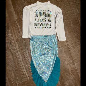 Mermaid Rash guard and skirt bottom.